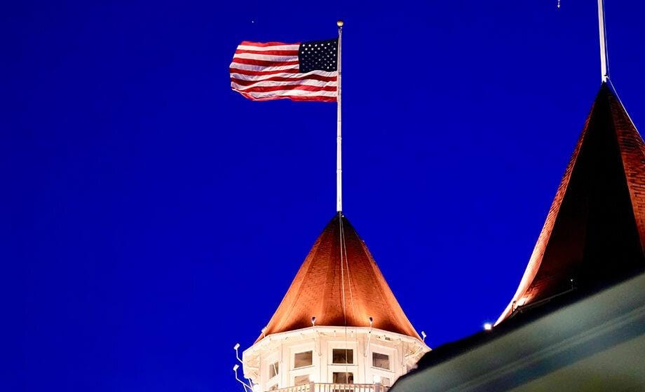 Spotlight on HOA flagpole and entrance sign